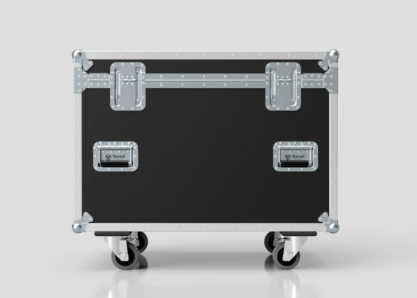 The MUT Trunk Case, in black and silver with metal reinforcements, latches, handles, and four caster wheels, features a variable divider system for organized storage. Shown against a plain light background.
