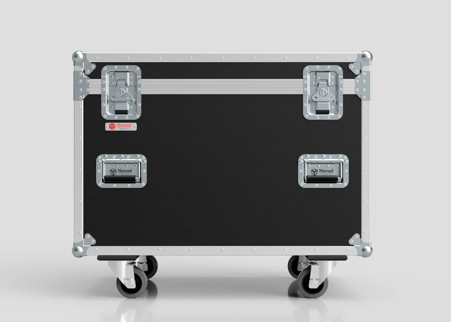 The MUT Trunk Case, shown in black and silver with metal edges, handles, latches, and caster wheels, is set against a plain light background and features a variable divider system for versatile organization.
