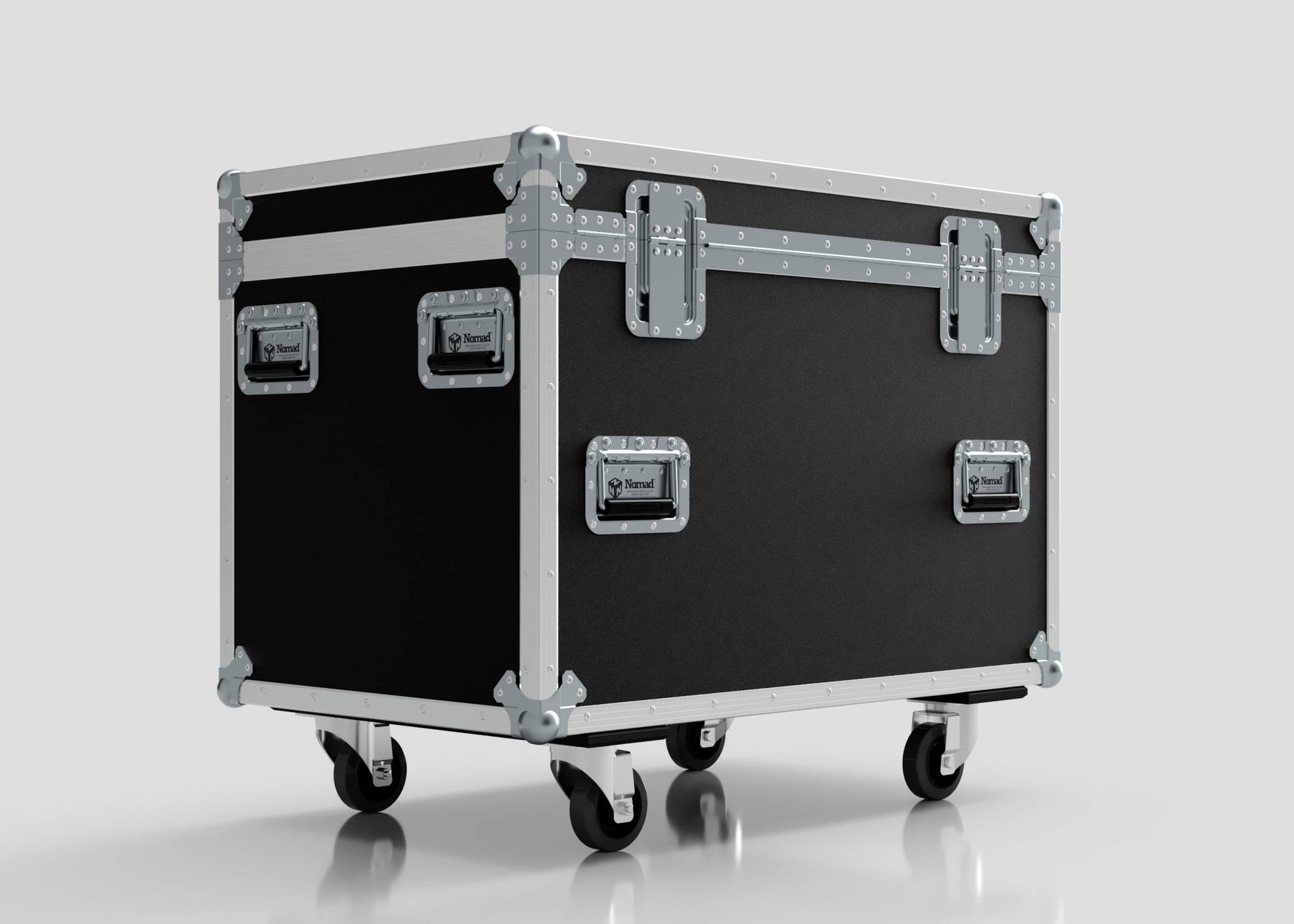 The MUT Trunk Case is a large black multi-utility flight case with metal edges, secure latches, wheels for easy mobility, and an adjustable divider system, shown against a plain light background.