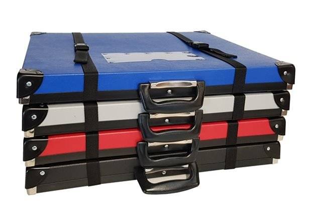 The Print Portfolio: a set of four flat, rectangular poly boxes in blue, gray, red, and black, each with a handle and black straps for easy, secure transport and ideal mounted print storage, shown on a white background.