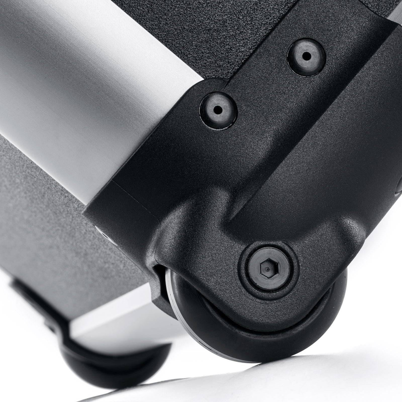 Close-up of a black plastic caster wheel attached to the Robust 50200N (555 x 425 x 235) case, featuring a metal and textured surface—ideal for impact-resistant equipment protection.