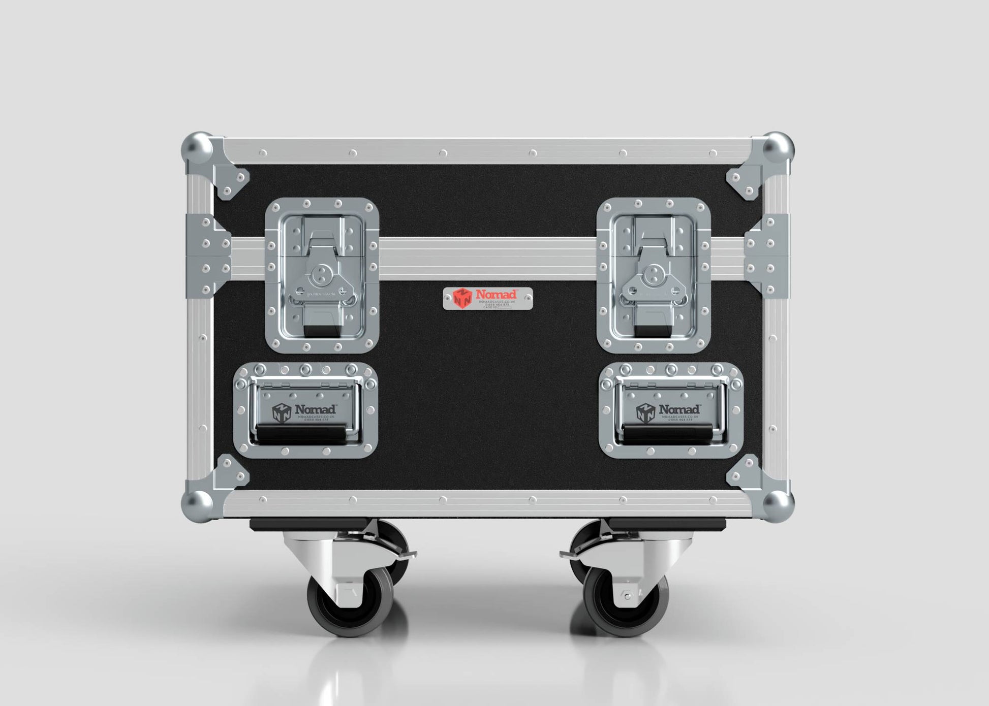 The Single 1 Ton EXE Motor Chain Hoist Case, in black and silver with metal reinforcements, two handles, and two latches, features the Nomad logo and measures 696 x 607 x 580 mm, standing against a plain background.