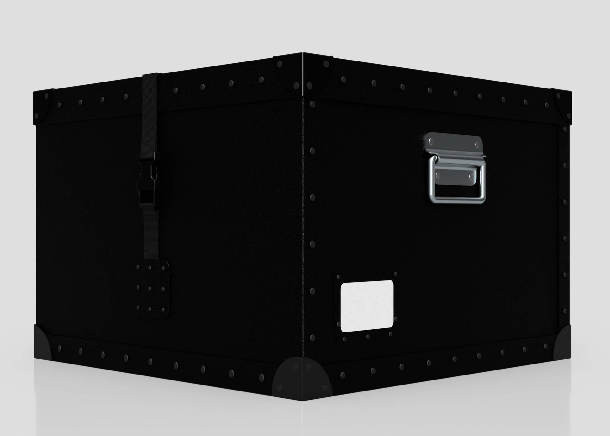The Standard Cube Storage Box - Medium is a large black metal trunk with rivets, handle, latch, and a poly card holder for labeling, displayed on a plain light background.
