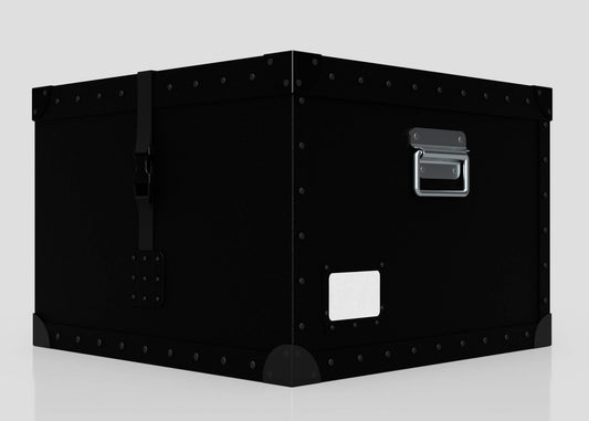 The Standard Cube Storage Box - Medium is a large black metal trunk with rivets, handle, latch, and a poly card holder for labeling, displayed on a plain light background.