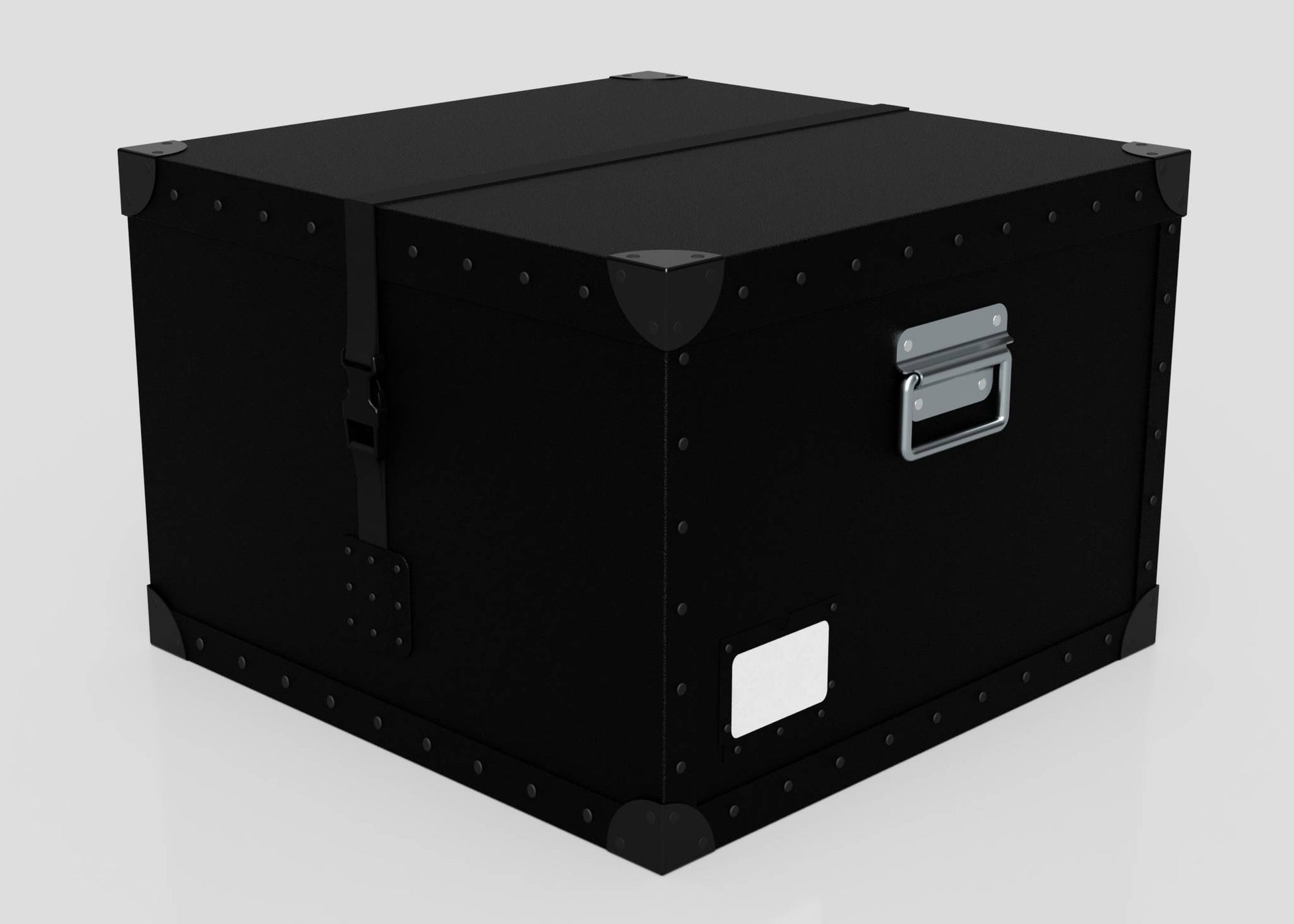 The Standard Cube Storage Box - Medium is a black rectangular polyethylene box featuring metal corner protectors, a webbing buckle latch strap, a metal handle, and a white side label, shown against a plain background.