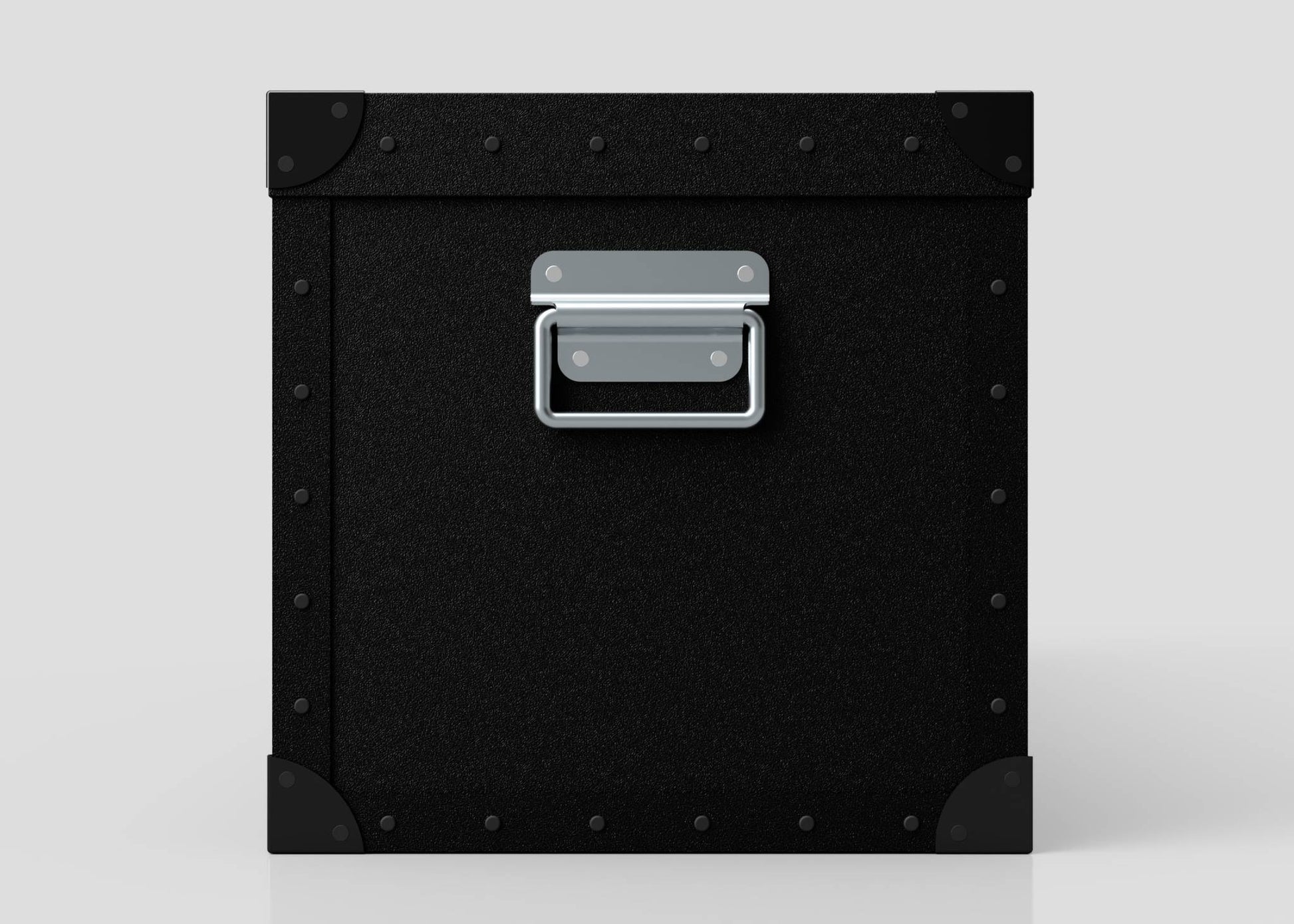 The Standard Long Storage Box - Medium is a black, square polyethylene box featuring riveted metal corners and a zinc drop handle on the front, shown against a light gray background.