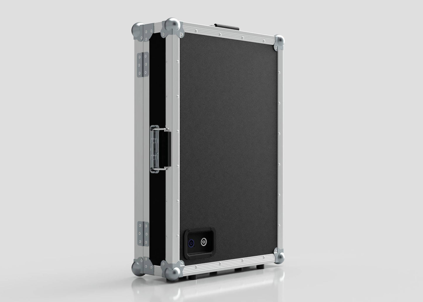 The Vanity Dressing Room Makeup Mirror Case is a black and silver hard-sided case with metal edges, corner protectors, a side handle, and a small rectangular power port on one side.