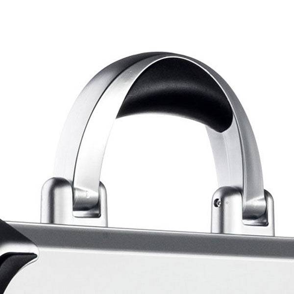 Close-up of the VDK 97100: a silver aluminium case with a metallic handle and black grip, from the design series, possibly featuring custom CNC foam fittings inside.
