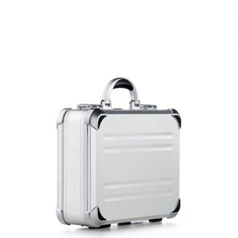 The VDK 97100 is a small, silver aluminium case with rounded edges, a sturdy handle, and custom CNC foam fittings, shown against a plain white background.