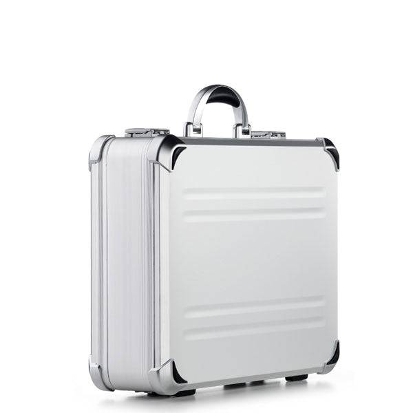 The VDK 97300 features a silver aluminium case with custom CNC foam interiors, rounded edges, reinforced metal corners, and a top handle, shown standing upright on a white background.