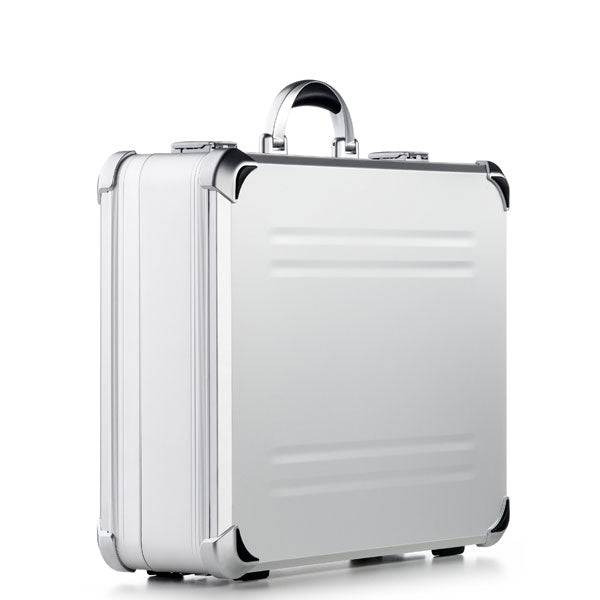 The VDK 97700 features a sleek aluminium case with custom CNC foam, silver hard shell, black corner protectors, and a sturdy handle, shown against a plain white background.