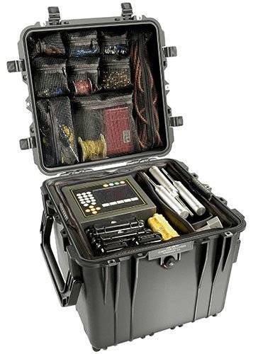 The black 0340 Protector Cube Case features organized compartments to hold electronic equipment, cables, tools, and a control panel inside.