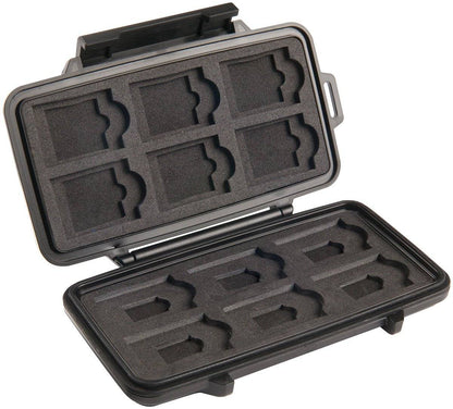 The 0915 PELI Micro™ Memory Card Case, made of black hard plastic, is shown open with foam slots that securely hold up to eight SD memory cards.