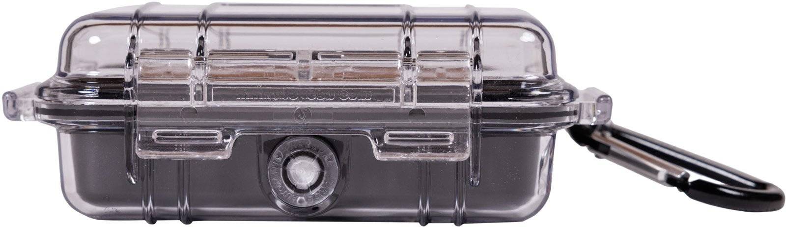 The 1010 PELI Micro™ Case is a small, transparent, crushproof hard plastic case with a latch and black carabiner, providing durable protection for your essentials.