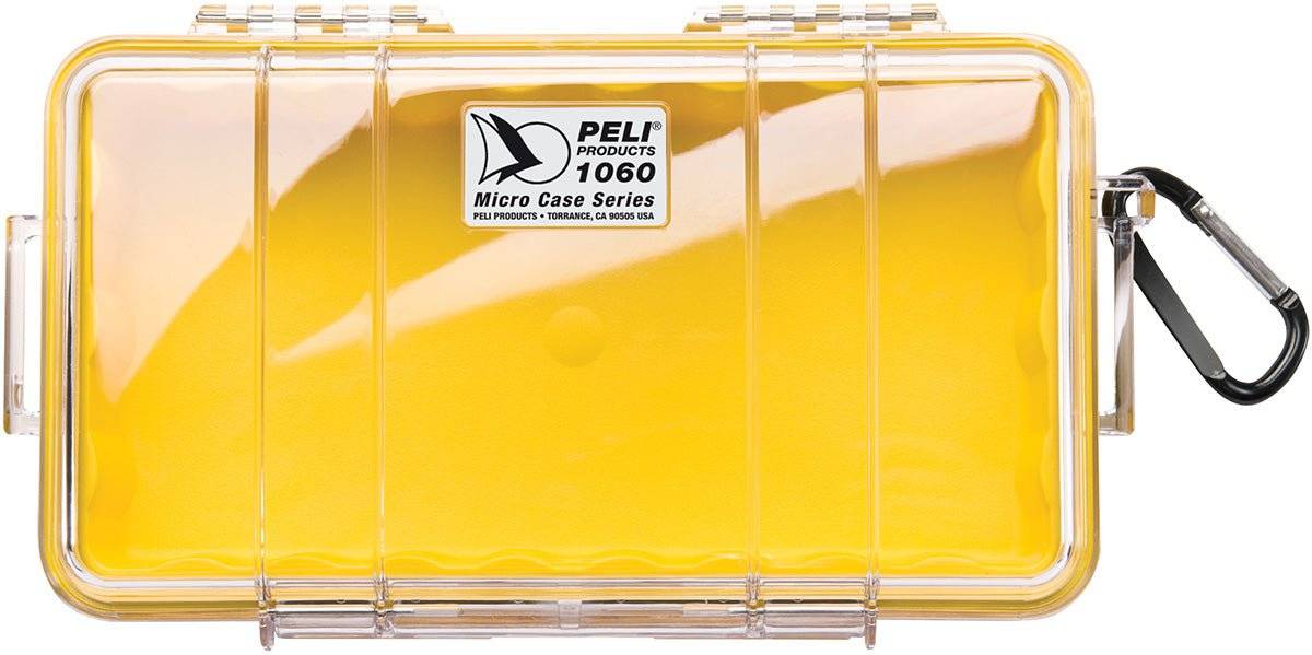 A closed 1060 PELI Micro™ Case in clear hard plastic with a yellow insert and black carabiner, shown from above—this crushproof case keeps your essentials secure and protected.