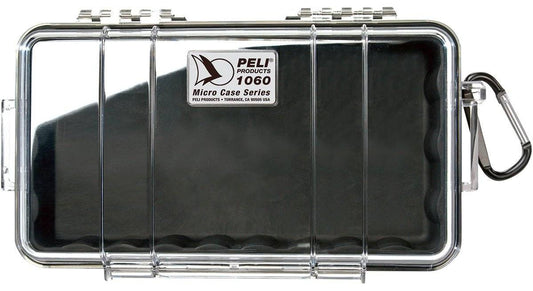 The 1060 PELI Micro™ Case is a clear, hard plastic case with a black interior, metal latch, and carabiner. Crushproof and secure, it keeps your valuables protected.