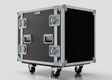 The 13U Suspended Shock Mounted Rack Case is a large black and silver flight case with protective metal edges, latches, handles, caster wheels, and suspended shock-mounted racks, shown against a plain background.