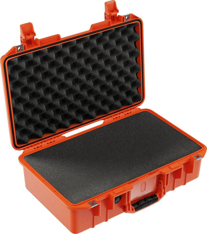 The 1485 Air Case is an open orange, lightweight hard case with black foam padding, designed to safely store and transport sensitive equipment. This waterproof case ensures maximum protection from impact and the elements.