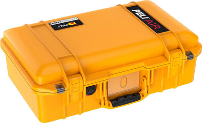 A closed, bright yellow 1485 Air Case with black latches, handle, and a lid label is displayed against a white background.