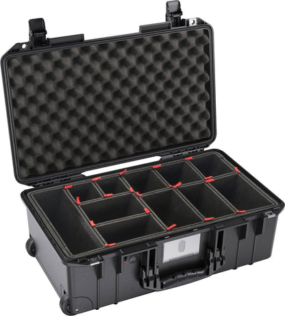 The 1535 Air Case is a black hard-shell carrying case with foam padding in the lid and multiple adjustable interior compartments, providing lightweight protection and reliable organization.