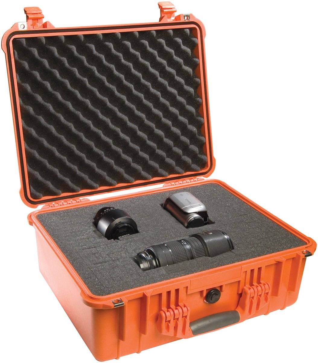 An open orange 1550EU Protector Case with foam lining holds a camera lens, a camera flash, and another camera accessory.