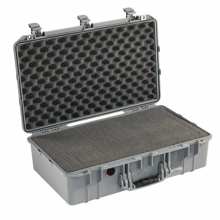 The 1555 Air Case is a hard plastic carrying case with an open lid, egg-crate foam padding, and a front handle—ideal as a protective or waterproof case like the PELI Air.