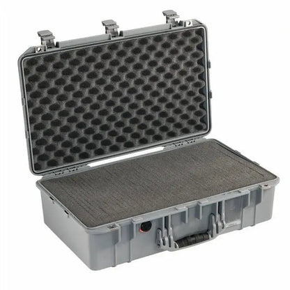 The 1555 Air Case is a hard plastic carrying case with an open lid, egg-crate foam padding, and a front handle—ideal as a protective or waterproof case like the PELI Air.