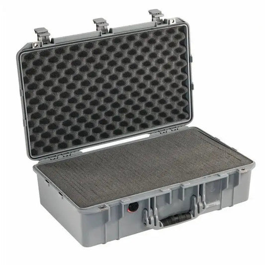 The 1555 Air Case is a hard plastic carrying case with an open lid, egg-crate foam padding, and a front handle—ideal as a protective or waterproof case like the PELI Air.
