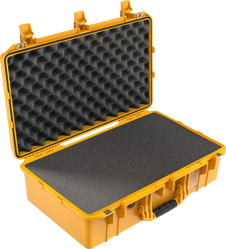 The 1555 Air Case is a yellow hard shell waterproof case with black foam-lined interior, featuring egg crate foam in the lid and flat foam in the base—perfect for those needing a durable, protective case.