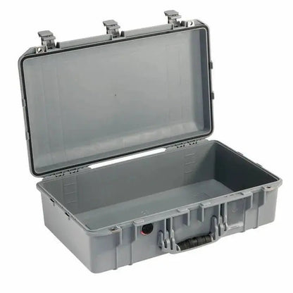 The 1555 Air Case is a gray, hard plastic waterproof case with an open hinged lid, black handle, and latch closures—shown empty on a white background—perfect for those wanting durable protection like the PELI Air line.