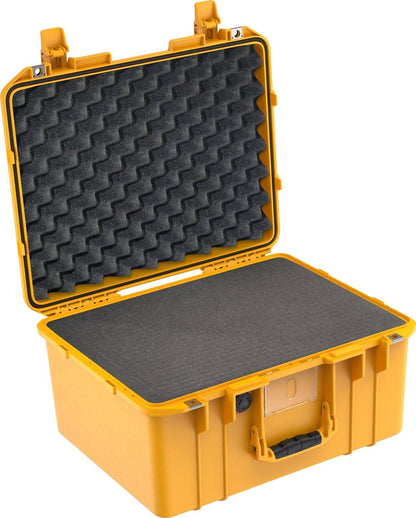 The 1557 Air Case is a yellow, lightweight polymer case with a handle, shown open. Its interior features fitted foam padding in the lid and base, making this waterproof case ideal for secure transport and protection.
