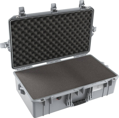 The 1605 Air Case is a large gray hard-shell waterproof case, open to reveal foam padding inside the lid and base for cushioning contents.