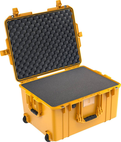 A yellow 1607 Air Case with an open lid shows black foam padding inside and features two wheels at the base for easy transport.