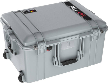 The 1607 Air Case is a gray PELI Air hard-shell waterproof case with black handles, latches, and wheels, designed for maximum protection on the go.