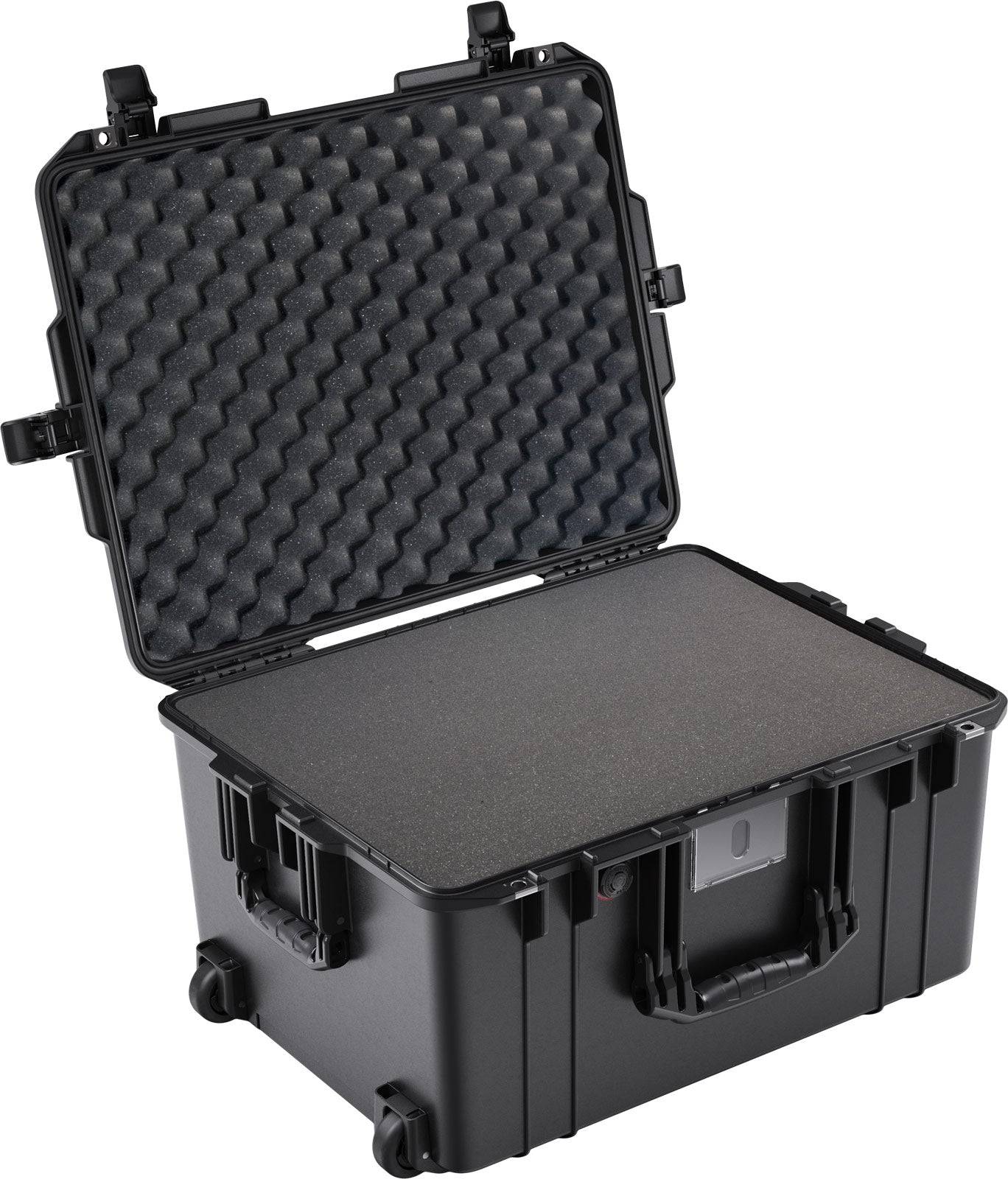 The 1607 Air Case is a black PELI Air waterproof case with a hinged lid open to reveal foam padding inside. This hard-shell protective case features secure latches and a handle for reliable protection.