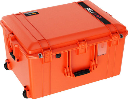A large, bright orange 1637 Air Case with black handles and wheels, waterproof and protective, labeled "PELI Air case" on top.
