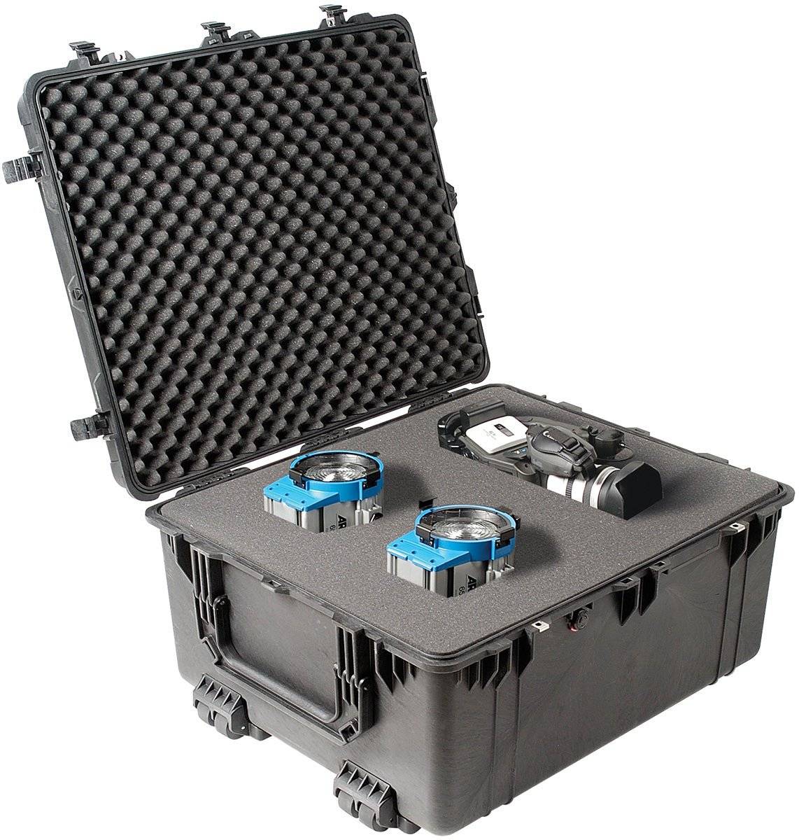 A crushproof 1690 Protector Transport Case with foam interior holds two blue electronic devices and a camera, its open lid revealing the contents.