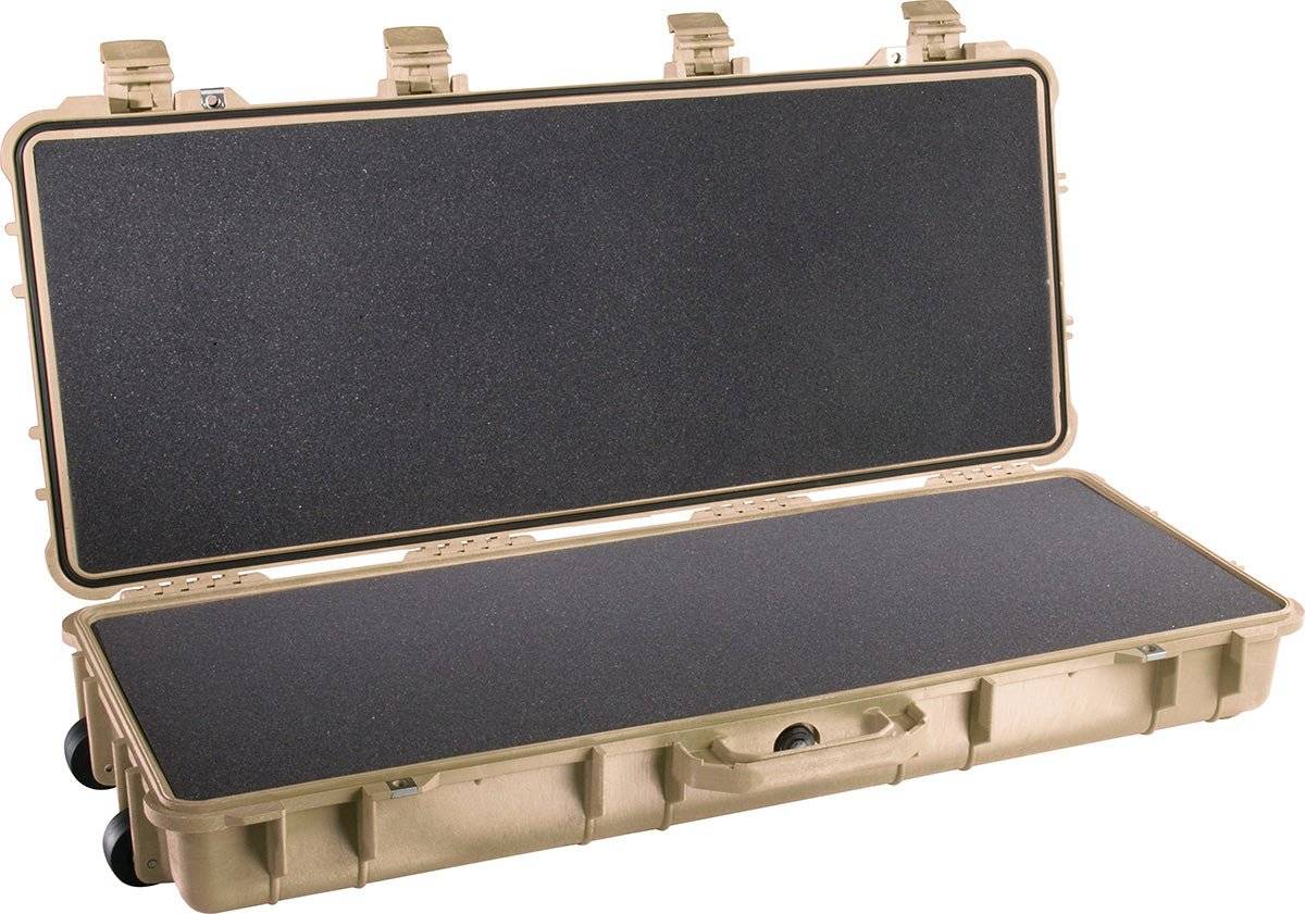 A tan 1700 Protector Long Case with an open lid reveals black foam padding inside. This crushproof case features sturdy latches and wheels for easy transport.