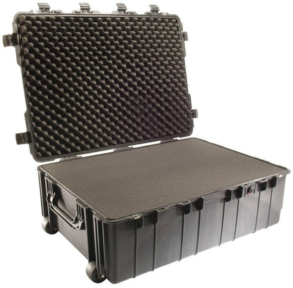 The PELI 1730 Protector Transport Case is a large black case with an open lid, egg crate foam padding, and a sturdy side handle—perfect as a watertight protective equipment transport case.