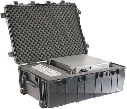 A black 1730 Protector Transport Case, a durable hard-shell rolling and watertight case with foam padding, securely holds a desktop computer tower and keyboard. The open protective case is displayed on a white background.