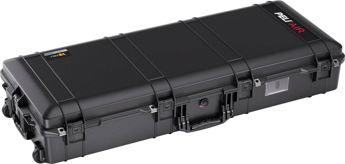 The 1745 Air Case is a black, lightweight polymer case with wheels and handle, rectangular in shape, closed and secured for transport or storage; it’s durable, waterproof, and designed for ultimate protection.