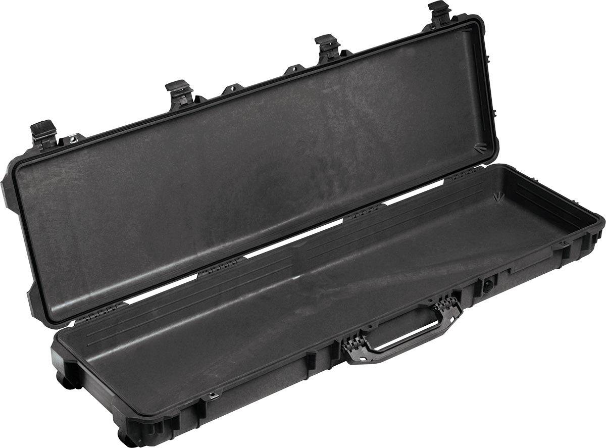 The black 1750 Protector Long Case is open and empty, showing its crushproof, watertight interior with secure latches on the top edge and a sturdy front handle.