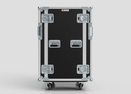 The 24U Double Bay Rack Case, featuring a black and silver finish with metal reinforcements, four latches, side handles, and wheels, stands upright against a plain background.
