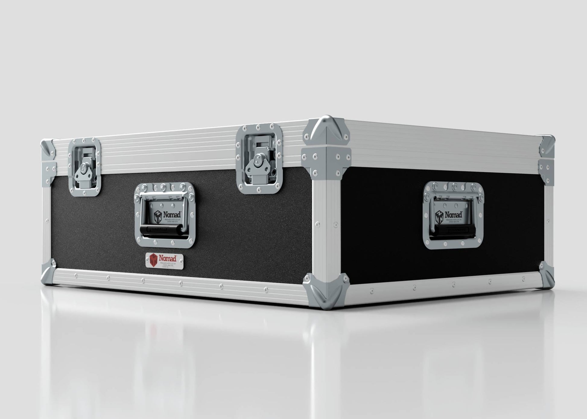 The 27" iMac Case, finished in black and silver with reinforced corners and metal latches, sits closed on a white reflective surface. Its external dimensions are 745 x 600 x 273 mm.