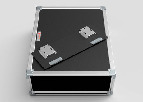The 2U Shock Mount Slam Rack Case is a black equipment case with metal edges and handles, featuring a detached panel with metal hinges on top; external dimensions: 738 x 609 x 224 mm.
