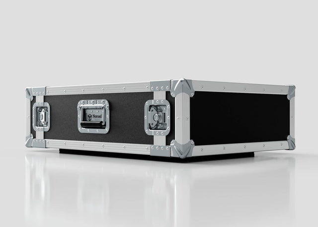 The 2U Suspended Shock Mounted Rack Case, a large rectangular black and silver case with metal-reinforced corners and latches, sits on a reflective white surface and provides superior protection with its shock mounted rack.