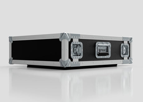 The 3U Foam Shock Mounted 19" Rack Case, featuring black and silver finish, reinforced metal corners and edges, heavy-duty latches, a side handle, and a foam mount rack, sits on a reflective white surface.