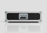 The 3U Slam Rack Case is a black and silver hard case with reinforced metal corners and a central handle featuring the Nomad logo, set on a reflective white surface; its external dimensions are 643 x 561 x 204 mm.