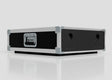 A 3U Slam Rack Case, a rectangular black and silver hard case with metal reinforcements, front handle, and side circular cutouts (external dimensions: 643 x 561 x 204 mm), is placed on a white surface.