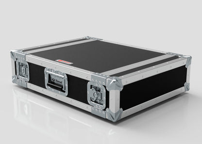 The 3U Standard Rack Case, in black and silver with metal corners, latches, and a handle, provides durable protection for your equipment as it rests on a light surface.